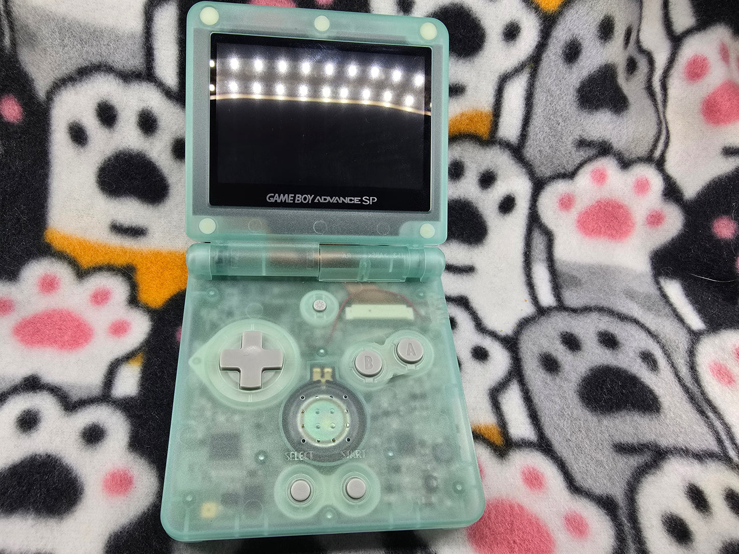 Open Game Boy Advance SP with IPS screen – front view of modded console